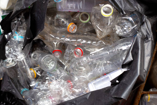istock Plastic bottles in blue waste bag 2164872686