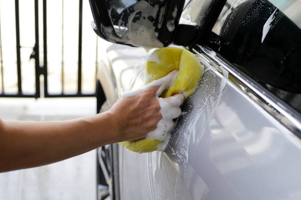 istock Washing car with yellow sponge 2164873123