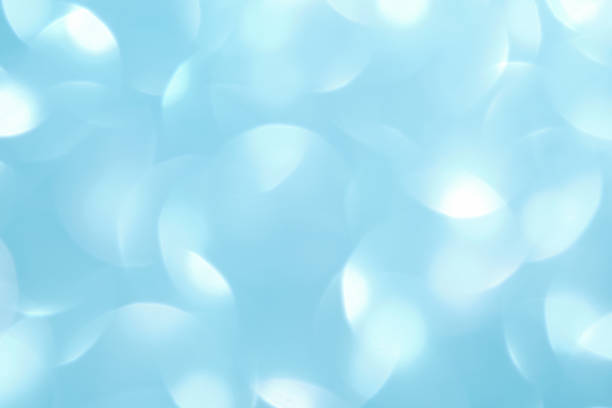 Abstract blue festive christmas background with bokeh.