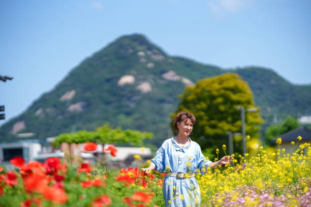 Senior woman at the flower field