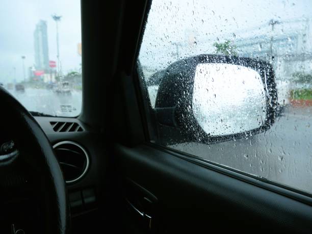 istock View of the side mirror of a car while it is raining. 2164885517
