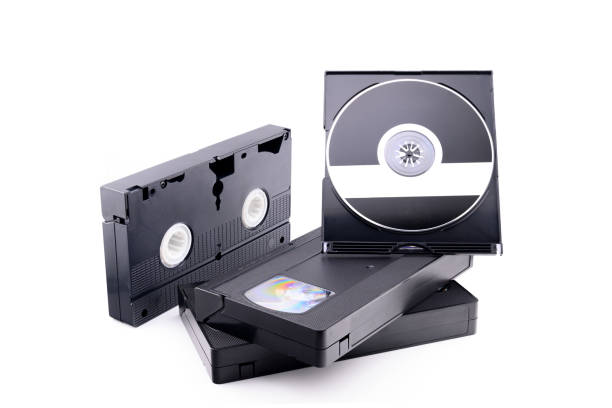 istock video cassette and compact disc on white background, VHS vs DVD 2164889352