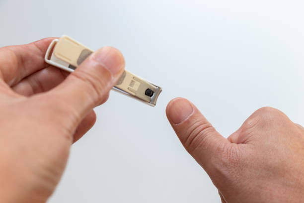 istock Cut a thumb nail with nail clippers 2164890749