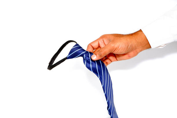 Blue striped tie on a dark wooden table