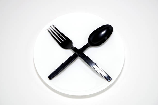 White colour food plate with cutlery set close up view food concept photography