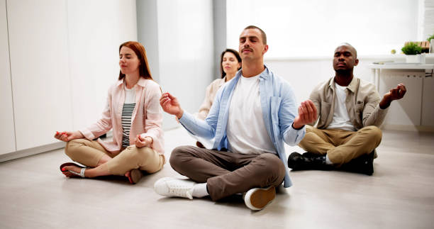 istock Office Employees Meditate In Yoga Class 2164892105