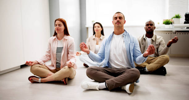 istock Office Employees Meditate In Yoga Class 2164892112