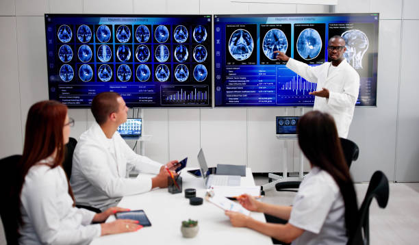 istock Doctors In Clinic Looking At Brain MRI Scan 2164892116