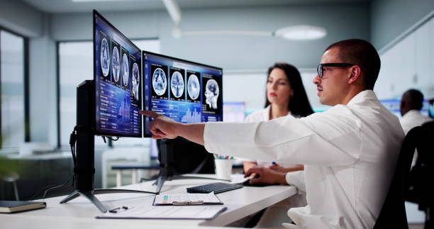 istock Doctors In Clinic Looking At Brain MRI Scan 2164892186