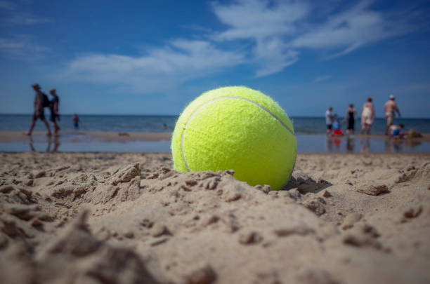 istock Yellow ball on a beach 2164894971