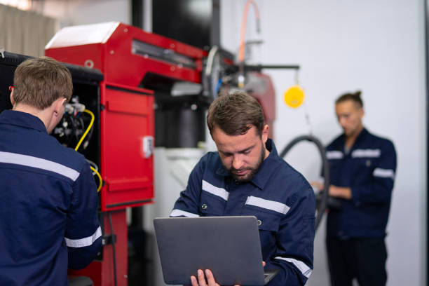 istock Group of Engineers are working at robotics workshop. 2164895845