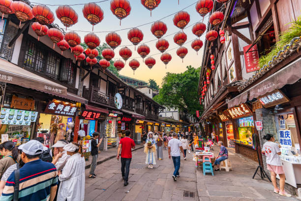 Chonqing, China - 7 May 2024: People walking in the streets of Ciqikou Ancient Town, a famous tourist attraction in Chonqing.
