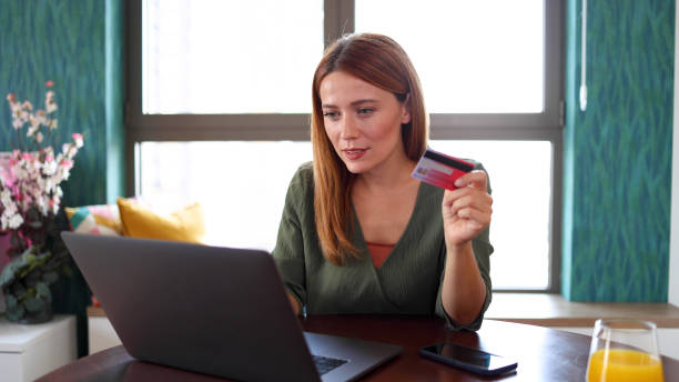 istock Excited woman shopping online 2164897880