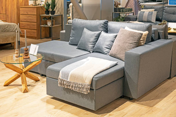 istock modern interior with a sofa, armchairs and a table and a candlestick with candles in the living room 2164901880
