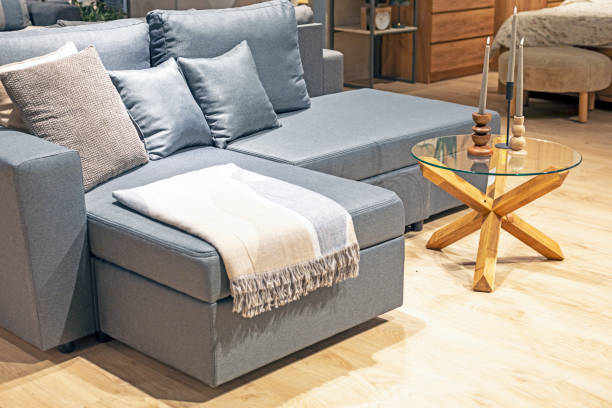 istock modern interior with a sofa, armchairs and a table and a candlestick with candles in the living room 2164901891