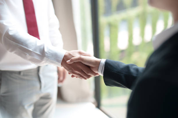 istock job applicant successful in job interview with resume and documents. 2164904304