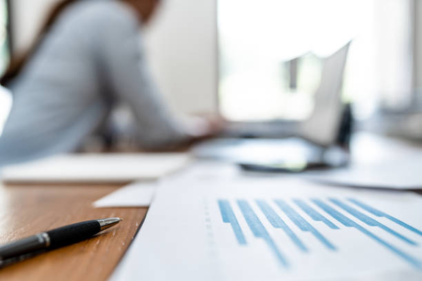 istock Startup business people calculating a valuation in workplace, Selective Focus on pen. 2164904604