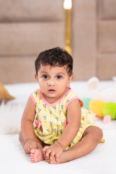 istock Happy Baby Crawling on a Bed 2164906616