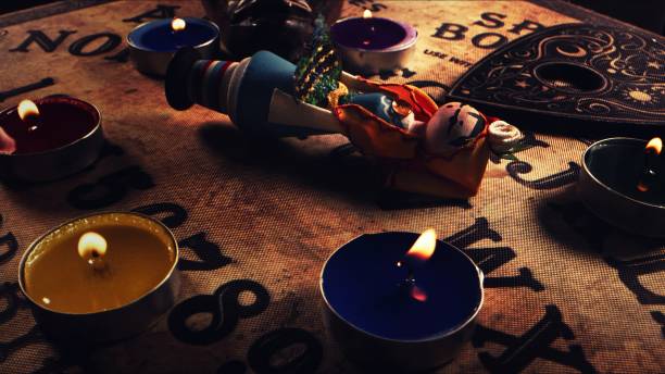 istock Witchcraft Ouija Board and Voodoo Magic Doll 2164912951