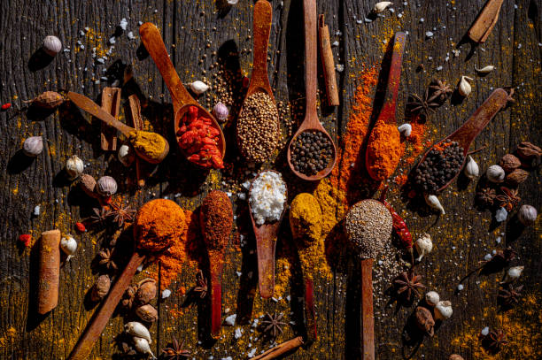 Aromatic Symphony: Spices and Herbs on Rustic Wooden Background