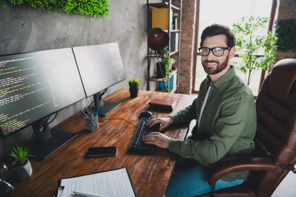 istock Photo of successful handsome man software expert wear shirt work with server pc system netbook indoors 2164914543