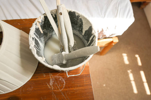 Paint brushes soaking in water so they don't go hard