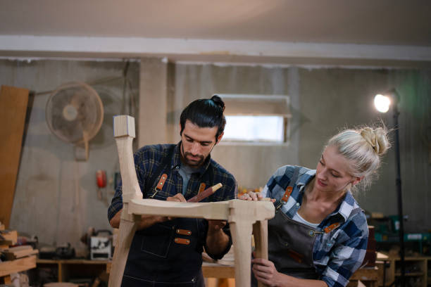 istock Carpenters are working together at workshop. 2164923859