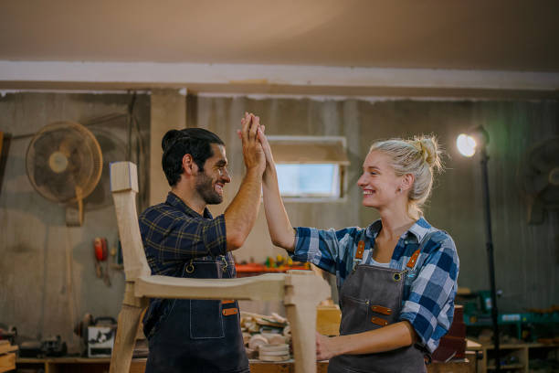 istock Carpenters are working together at workshop. 2164923886