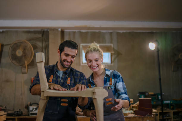 istock Carpenters are working together at workshop. 2164923892