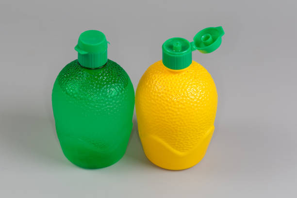 Set of tools to clean the kitchen. Washing up liquid, sponge on a bright yellow background