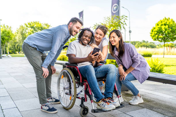 istock Cheerful friends using phone together outdoors 2164933508
