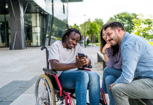 istock Cheerful friends using phone together outdoors 2164933559