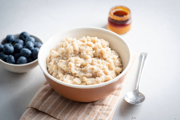 istock Breakfast oatmeal bowl, steel cut oats 2164934818
