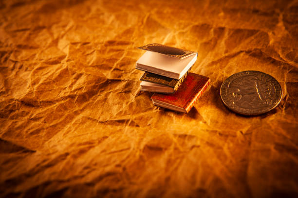 istock image of book coin paper background 2164939264