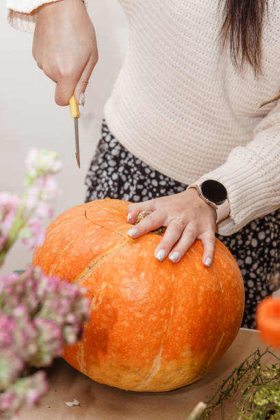 istock Creating a floral composition in a pumpkin. Making decor with your own hands. 2164939269