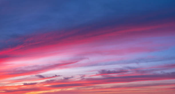 istock Beautiful Sky with clouds glowing at sunset 2164942353
