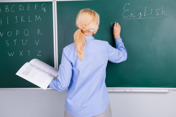 Photo of qualified intelligent senior lady work as lecturer in classroom write topic isolated on green board background Photo of qualified intelligent senior lady work as lecturer in classroom write topic isolated on green board background. qualified report stock pictures, royalty-free photos & images