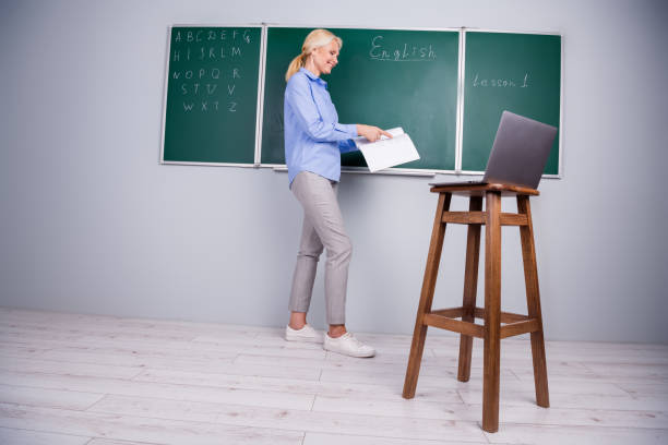 Photo of intelligent qualified confident woman university teacher work with pupil remotely Photo of intelligent qualified confident woman university teacher work with pupil remotely. qualified report stock pictures, royalty-free photos & images