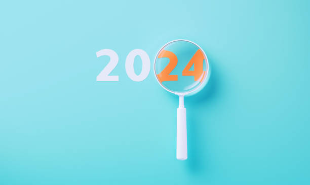 istock White Magnifier Over Orange 2024 On Blue Background 2164942954