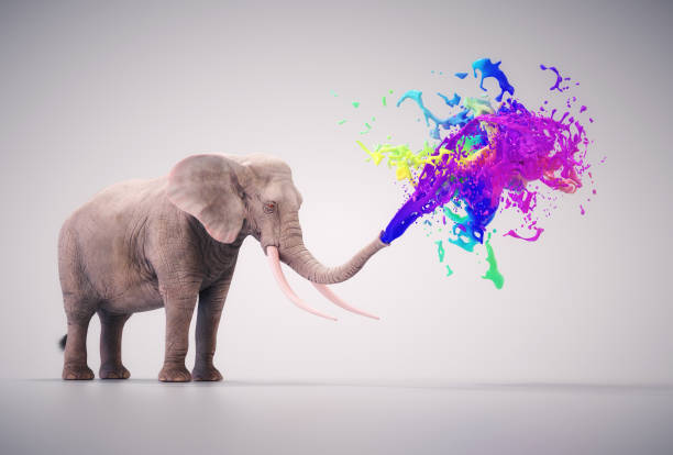 istock Elephant emits colorful stream off his trunk 2164946479