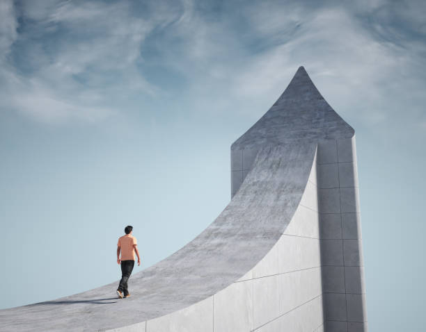istock Man climbs a giant arrow pointing to the sky. 2164946503