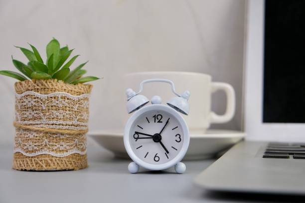 istock flat lay of a workplace with A cup of coffee, a laptop and a notebook, on a grey table. Education, business and office concept. 2164947063