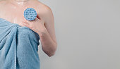 young-woman-wrapped-in-a-blue-bath-towel-holding-a-scalp-massage-brush-or-tool.jpg?b=1&s=170x170&k=20&c=oYSb8PWrlCP3xJ5K8YdRBIFNyHhR2hnZ517heBxq1QM=