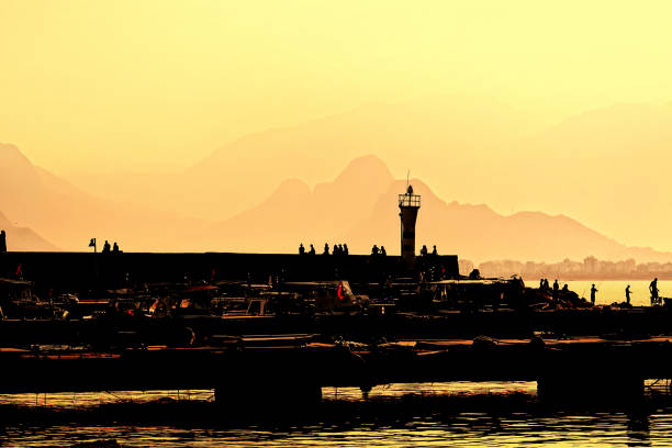 Group of silhouetted people at marina in Antalya, Mediterranean Turkey