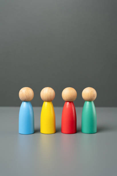 istock Multi-colored people figures. People representing different groups, communities and cultures. Consumer groups, their preferences and purchasing power. Marketing and segmentation. 2164952478