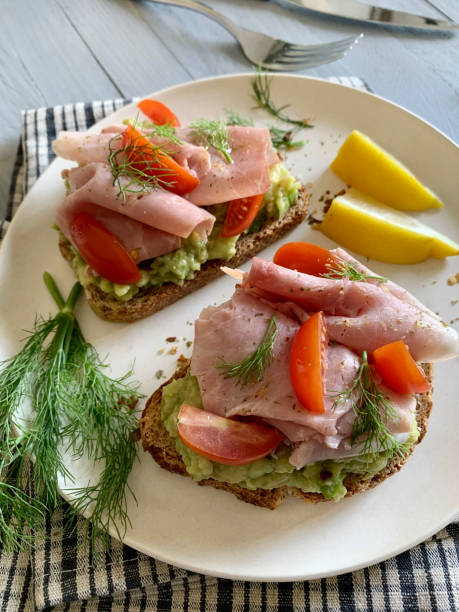 istock Avocado toast with prosciutto and tomato. 2164955162