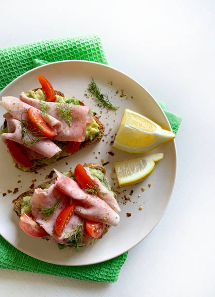 istock Avocado toast with prosciutto and tomato. 2164955168