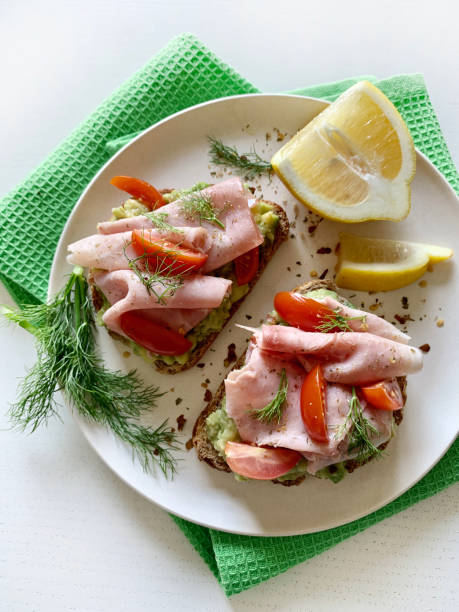 istock Avocado toast with prosciutto and tomato. 2164955212