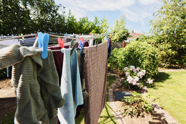 istock Clothes drying on a clothes line in a garden 2164957690