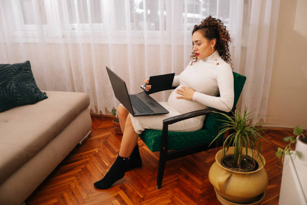 istock Pregnant woman working from home 2164957848